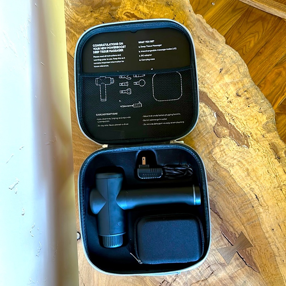 Thera gun new. Used a few times. All attachments and charger and original case